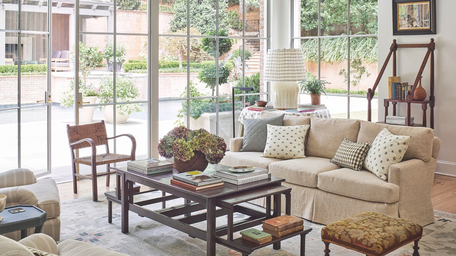Living room with large windows and vintage furniture